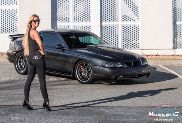 Olivia Hart with Chris Alfieri's 1998 Mustang